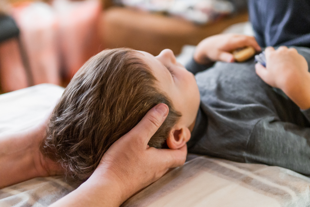 Child getting an adjustment by a Sparks, NV Chiropractor